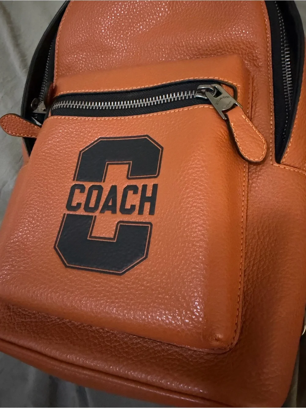 Coach Orange Leather Sling Bag with Black Strap and wristlet new without tags